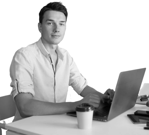 handsome-young-man-working-laptop-typing-freelance-job-online 1